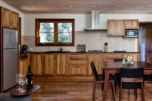 Mira Kitchen with solid wood cabinets and furniture.