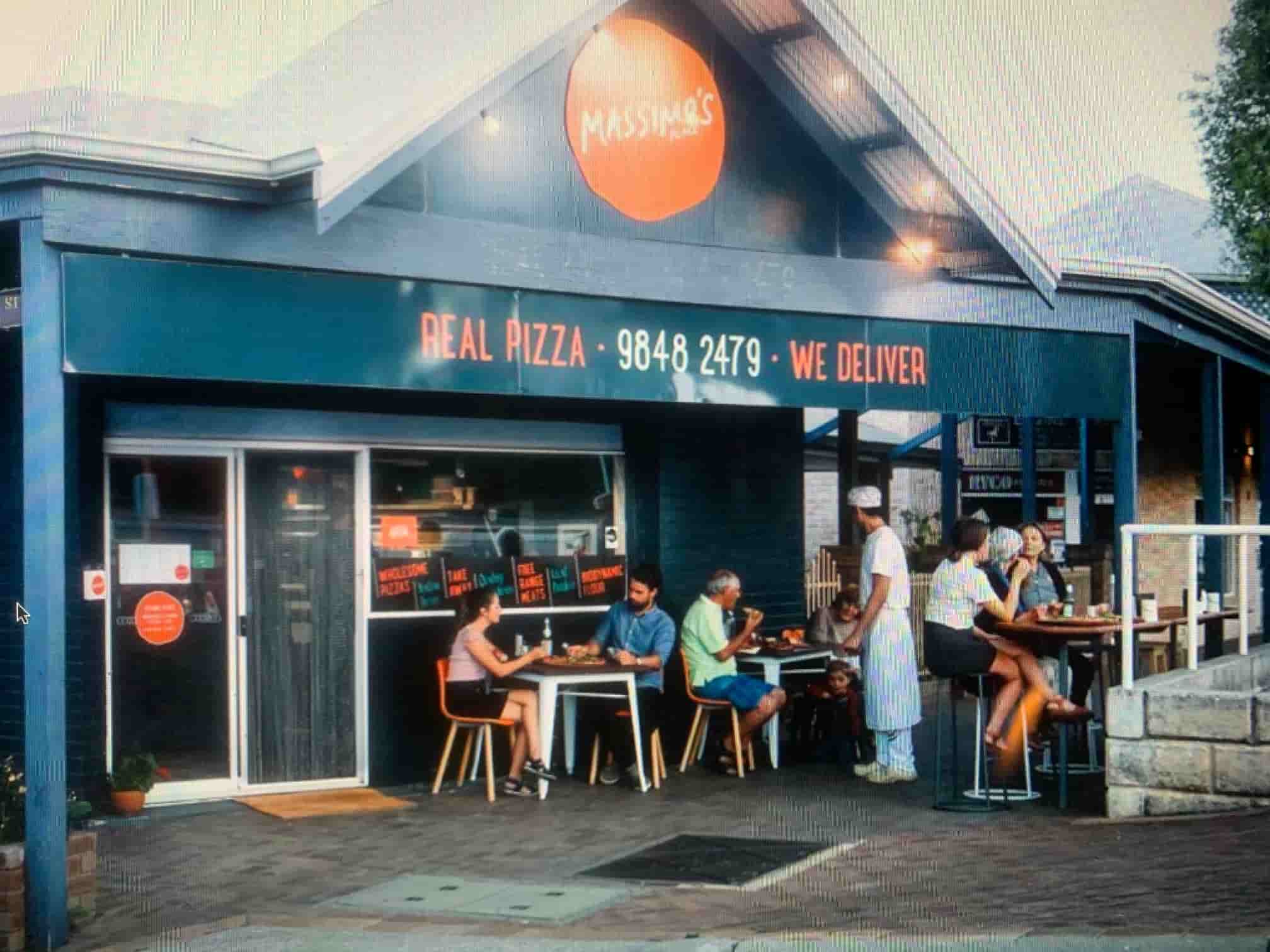 People sitting outside the pizza shop in Denmark